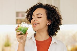 Women drinking green kratom smoothie